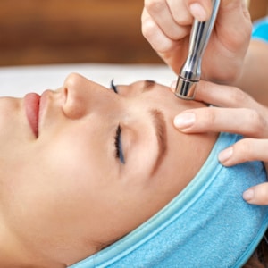 ultrasonic face cleaning, peeling, in a beauty salon ultrasonic face cleaning, peeling, in a beauty salon